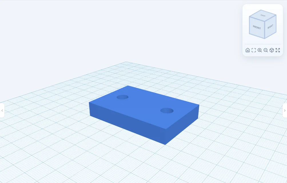 The same block with two clean bolt holes cut through it